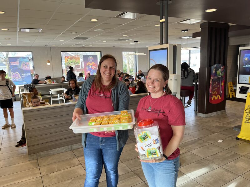 Teachers with a tray of apple pies