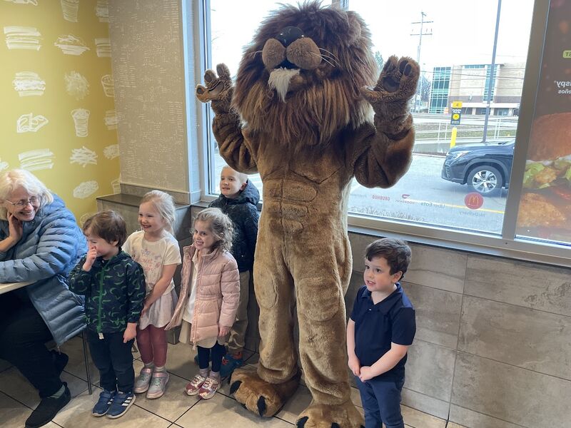 The mascot greeting kids